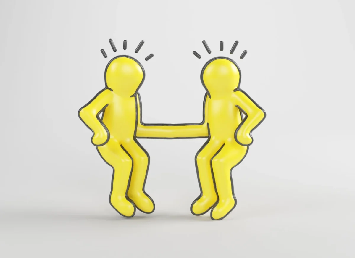 Two yellow stylised figures facing each other with bent knees and hands on hips, connected by a horizontal line forming the letter H, inspired by Keith Haring's artwork