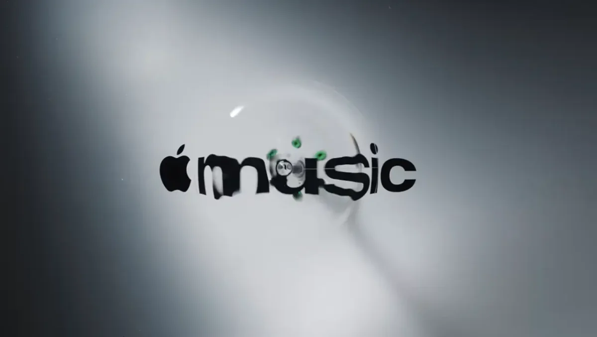 Apple Music logo with black text and musical note symbol surrounded by rippling waves against a grey gradient background