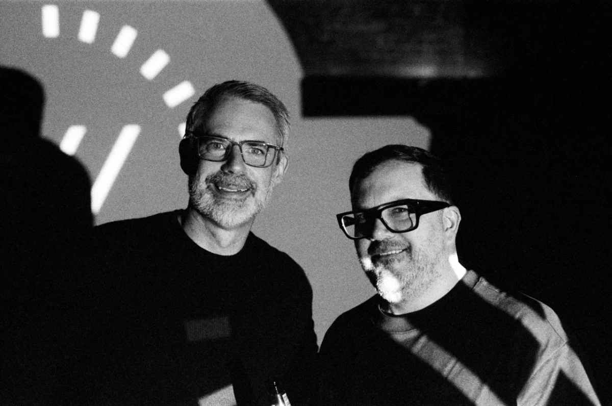 Bryan Edmondson, founder of SEA design studio, stands with a colleague at the studio's 30th anniversary celebration event
