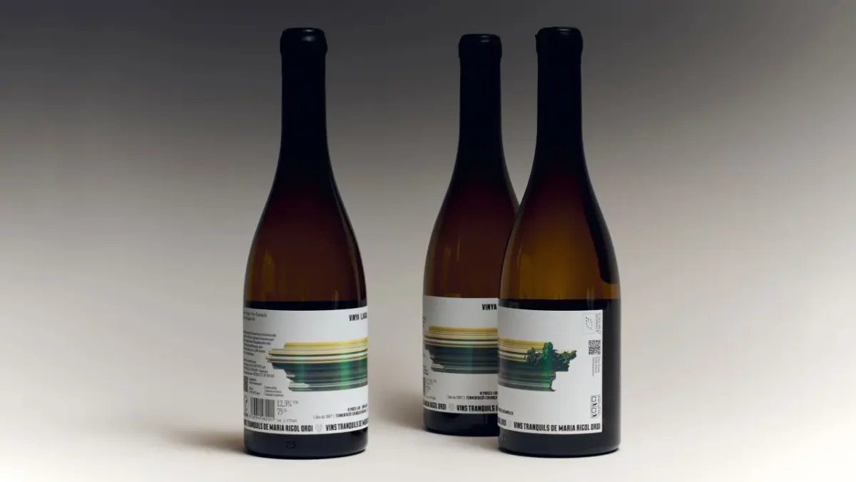 Three bottles of Vinya Llarga wine featuring labels with horizontal streaks of yellow, green and blue that evoke motion, like a photograph taken from a speeding train