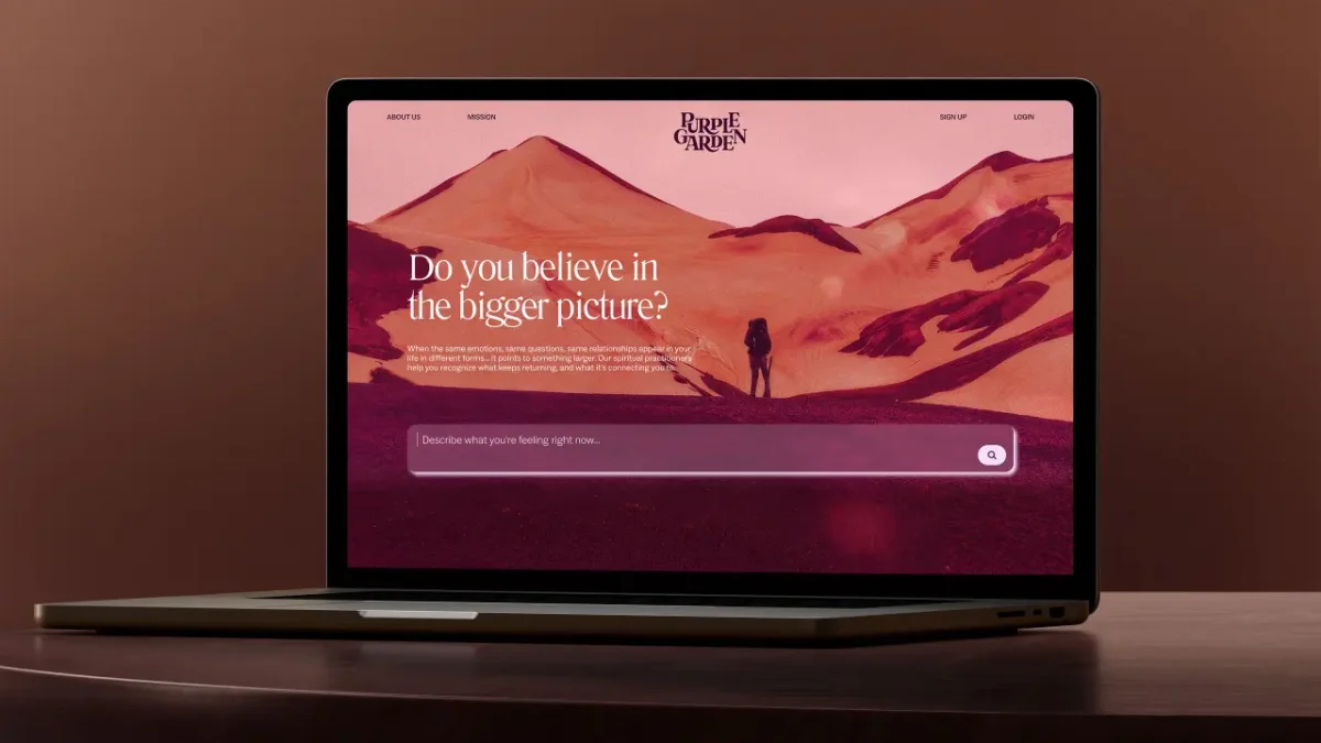 Purple Garden website homepage displayed on a laptop screen, featuring a desert landscape with a solitary figure and the text "Do you believe in the bigger picture?